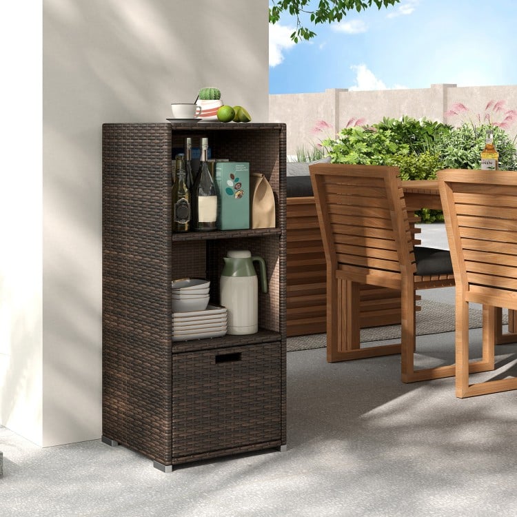 Outdoor wicker storage cabinet in brown with three shelves and a drawer, perfect for patio organization.