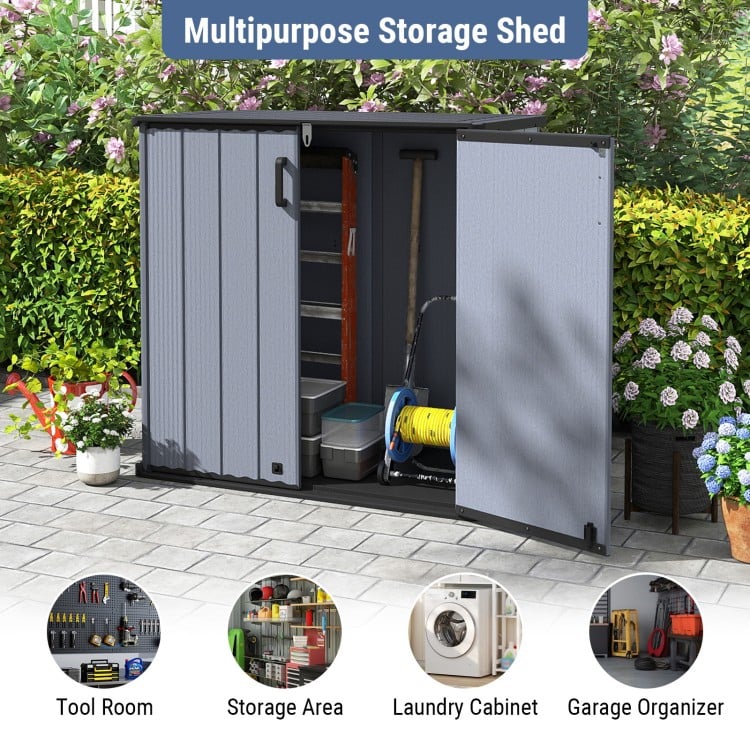 Gray outdoor storage shed with lockable door, ideal for organizing tools and equipment in various weather conditions.