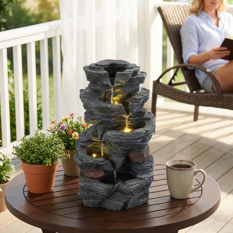 5-tier tabletop water fountain with LED lights, resin construction, and cascading design for outdoor relaxation.