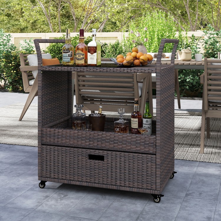 Outdoor wicker bar cart with tempered glass top, featuring ample storage, easy-grip handles, and four wheels for.