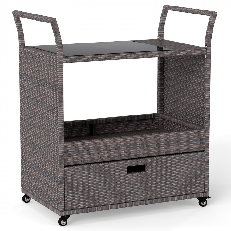 Outdoor wicker bar cart table with tempered glass top, featuring a large drawer and 4 wheels for easy mobility.