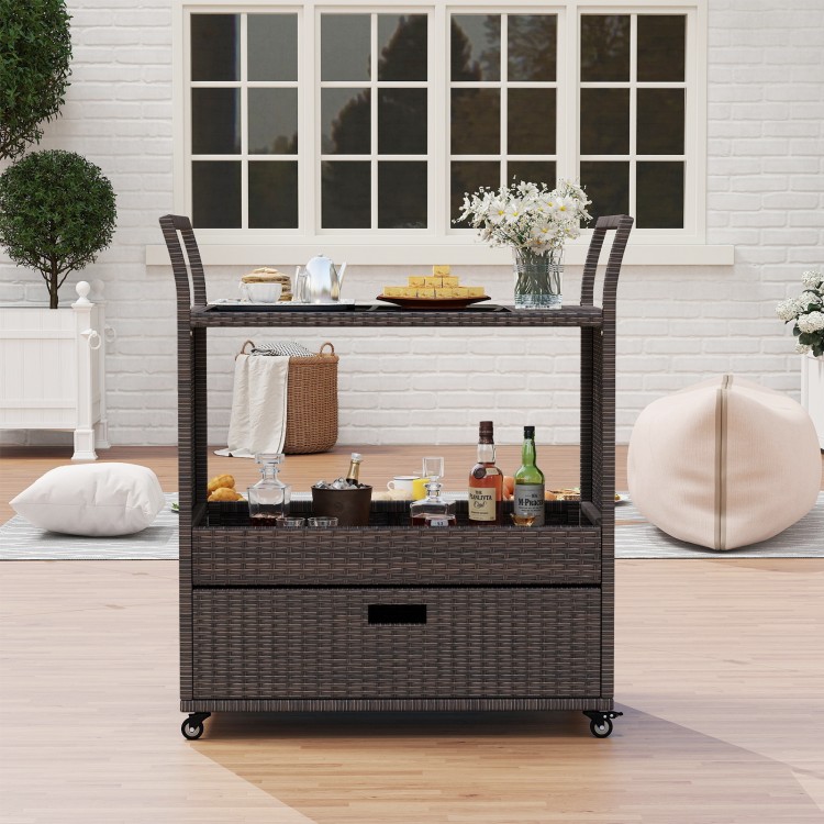 Outdoor wicker bar cart table with tempered glass top, featuring ample storage and mobility for patio or garden use.