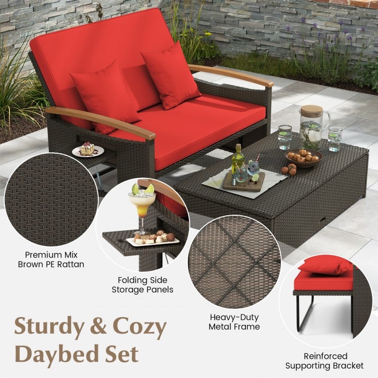 Outdoor wicker daybed set in red with folding side panels and storage ottoman, perfect for patio relaxation.