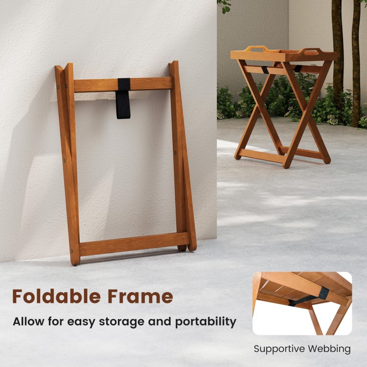 Foldable outdoor wood tray table with supportive webbing, ideal for easy storage and serving in patios or gardens.