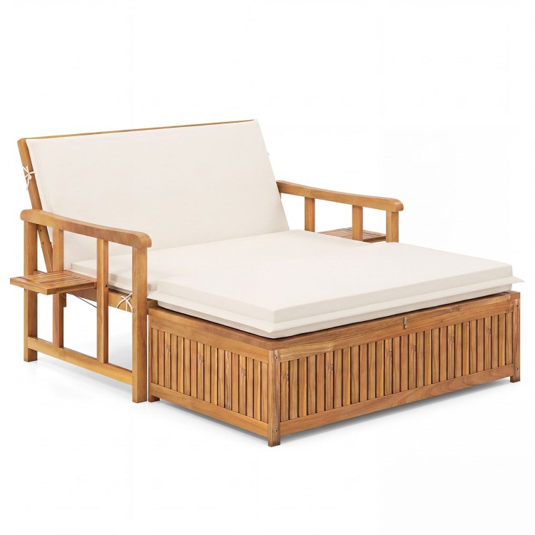 Outdoor wooden daybed with adjustable backrest, removable white cushions, and storage ottoman for backyard relaxation.