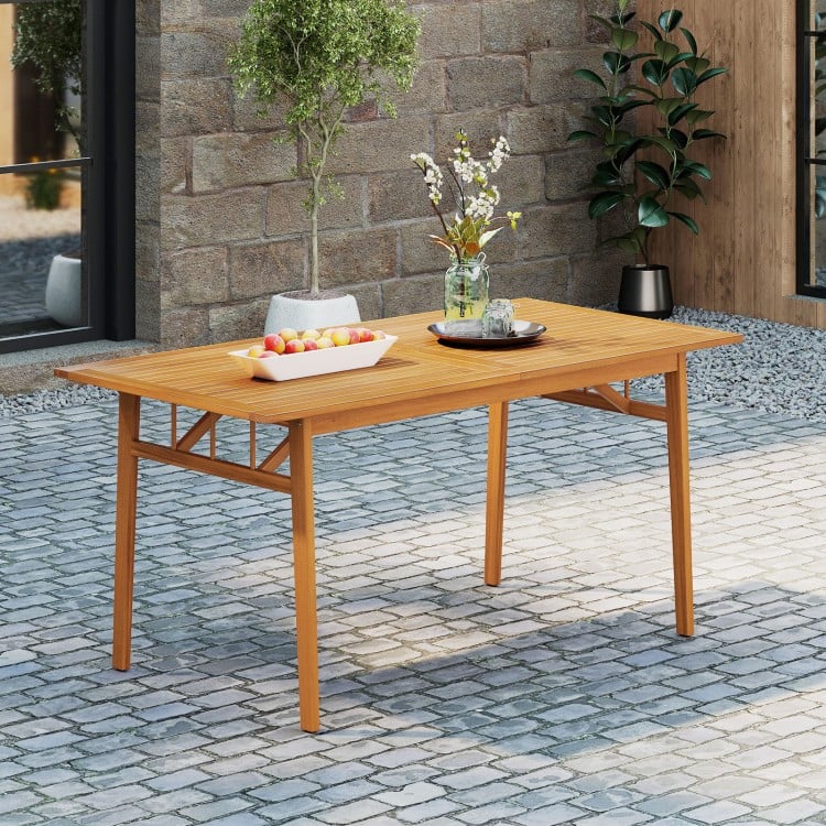 Outdoor wooden dining table made of acacia wood, featuring a slatted top and umbrella hole, perfect for patios and.