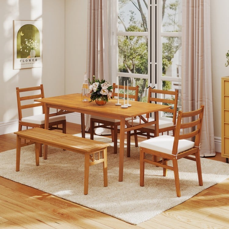 Outdoor wooden dining table made of acacia wood, featuring a wide tabletop and built-in umbrella hole, perfect for.