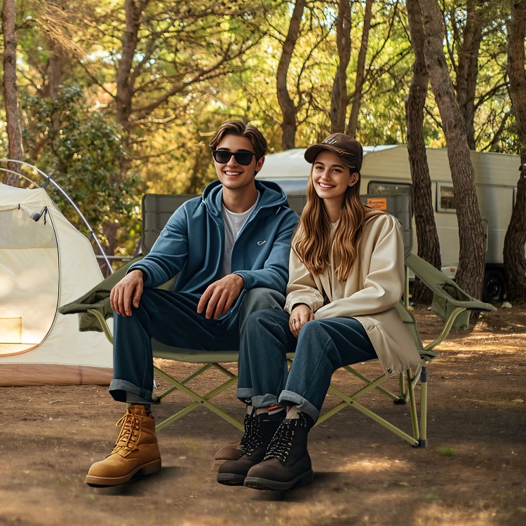 Oversized green camping loveseat with cup holders, thick padding, and adjustable armrests, perfect for outdoor.