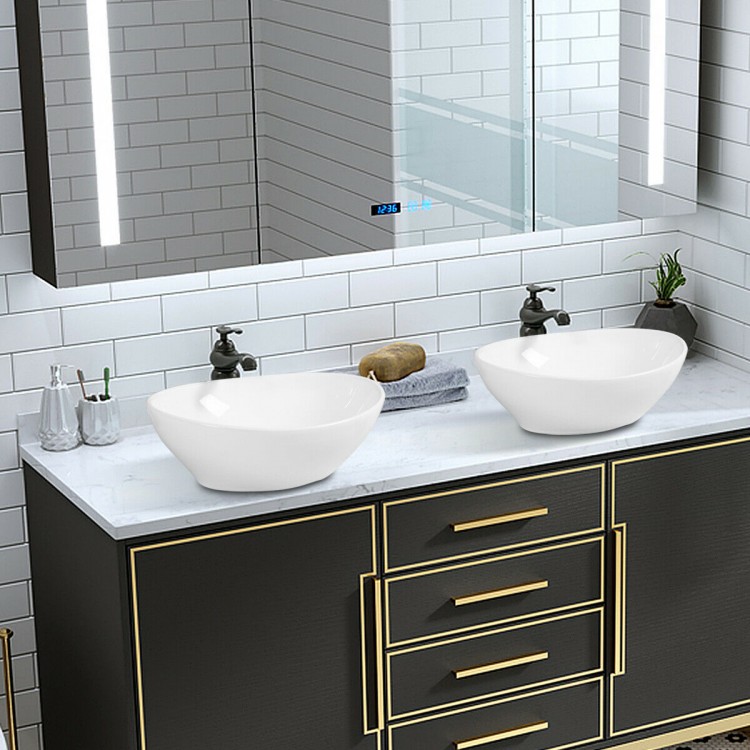 Contemporary oval ceramic vessel sinks with popup drain design, perfect for bathroom upgrades and aesthetic appeal.