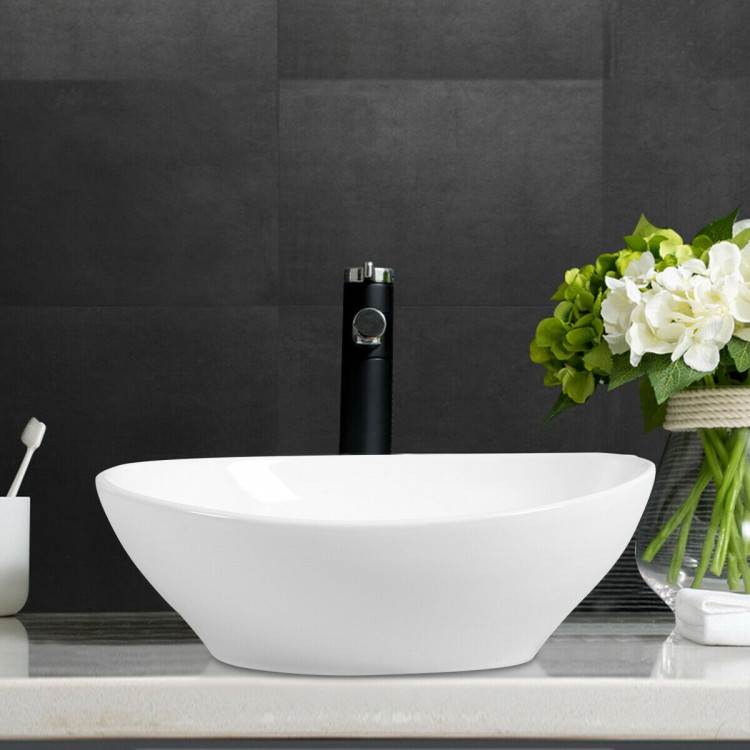 Sleek oval ceramic vessel sink with a polished exterior and popup drain design, perfect for enhancing any bathroom.
