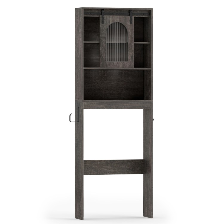 Over toilet storage cabinet in oak with sliding barn door and open shelves, perfect for organizing bathroom essentials.