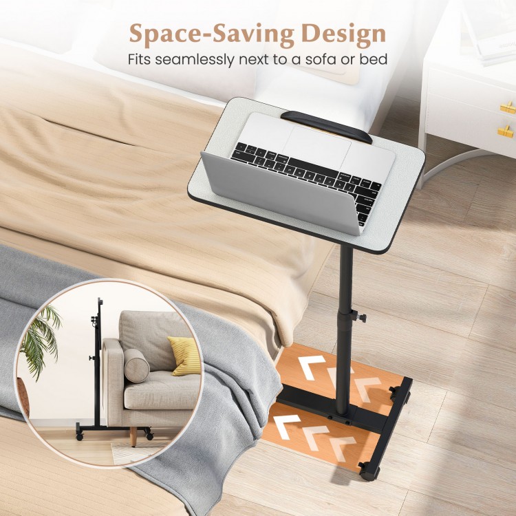 Gray overbed rolling table with adjustable height, 360° rotating tabletop, and low wheeled base for versatile use.