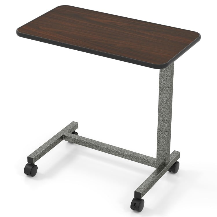 Overbed table with walnut finish, adjustable height, and lockable wheels, perfect for home or hospital use.