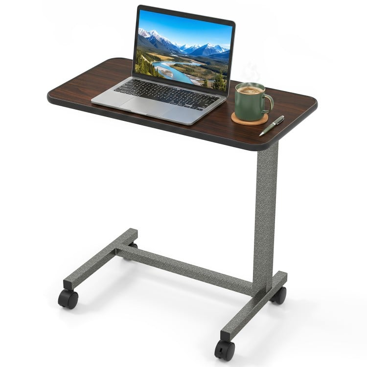 Overbed table with walnut finish, adjustable height, and lockable rolling wheels for versatile home and hospital use.