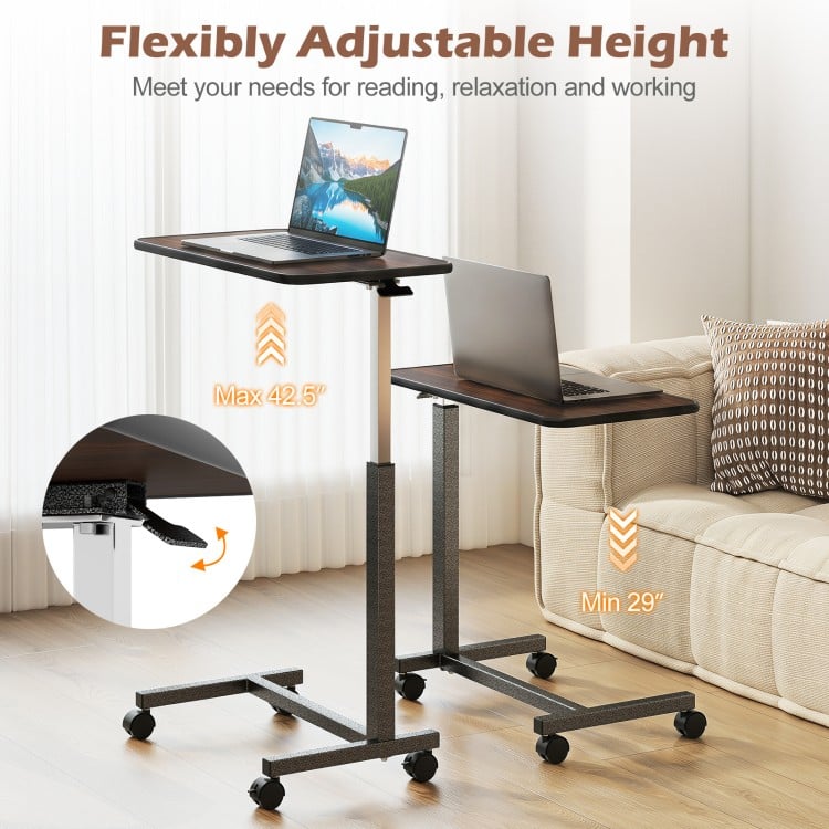 Overbed table with adjustable height from 29" to 42.5", featuring a walnut finish and lockable rolling wheels for stability.