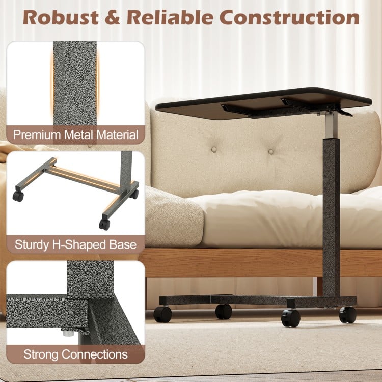 Overbed table with walnut finish, sturdy H-shaped base, and lockable rolling wheels for versatile home and hospital use.