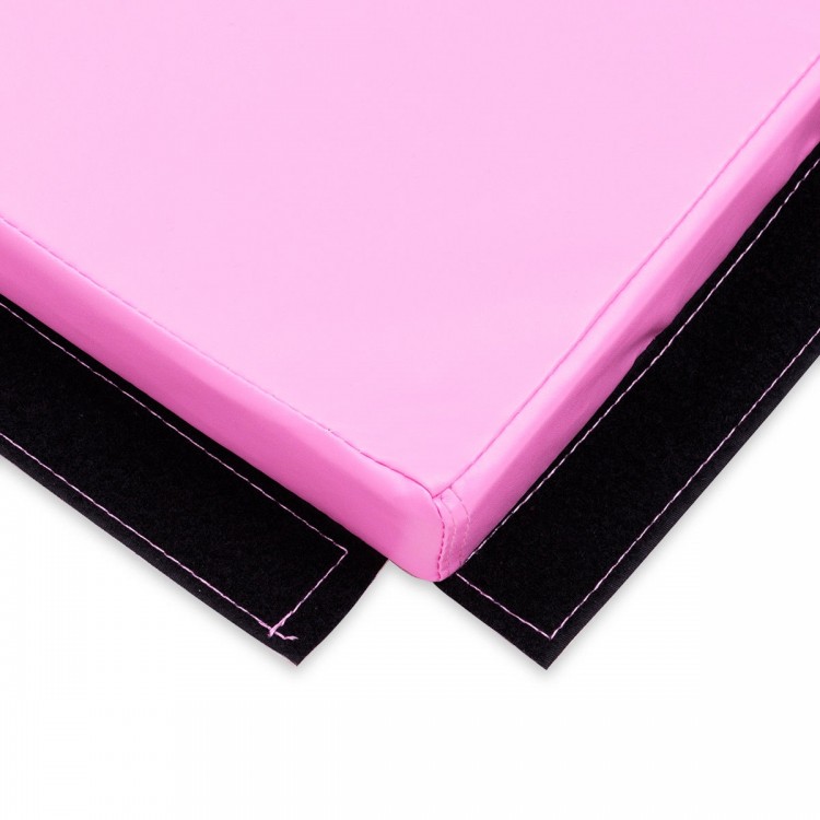 Close-up of a pink 4' x 6' x 2" PU thick folding exercise mat with Velcro edges for easy connection and storage.