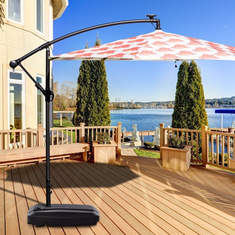 Water-filled patio umbrella base made of heavy-duty HDPE plastic, designed for stability in windy conditions.