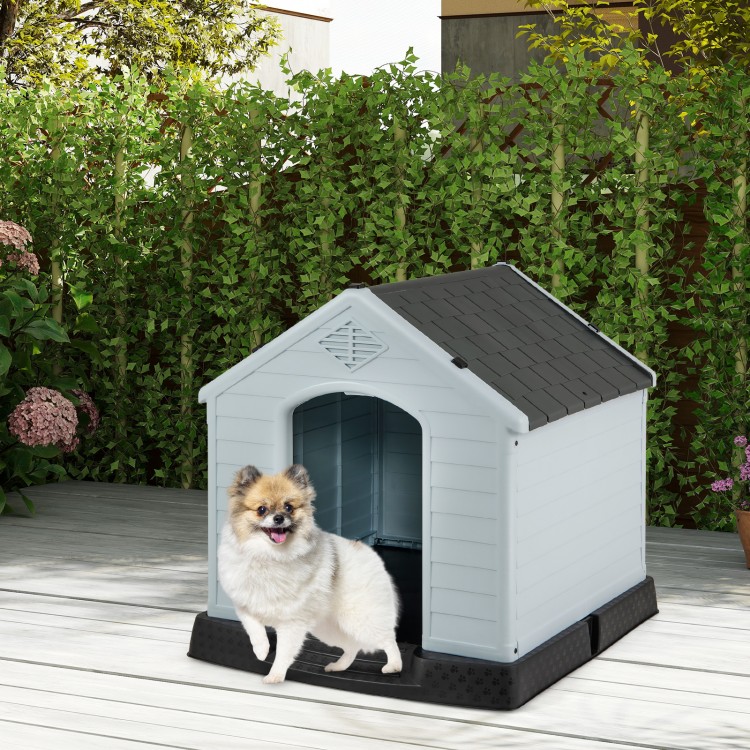 Small dog house made of waterproof plastic with an elevated floor, providing comfort and protection from the elements.
