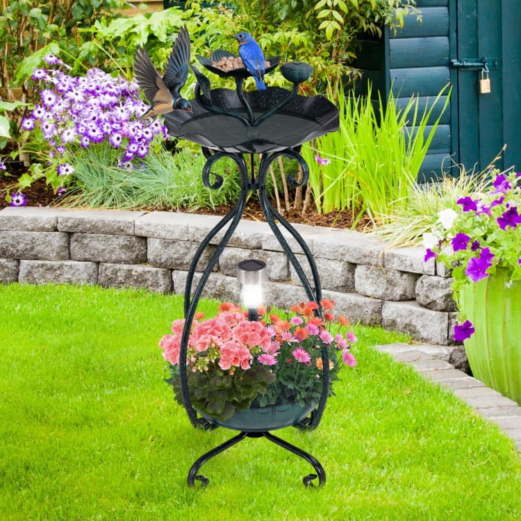 Solar outdoor bird bath feeder combo with flower planter, featuring a lotus leaf design and solar lights for garden.