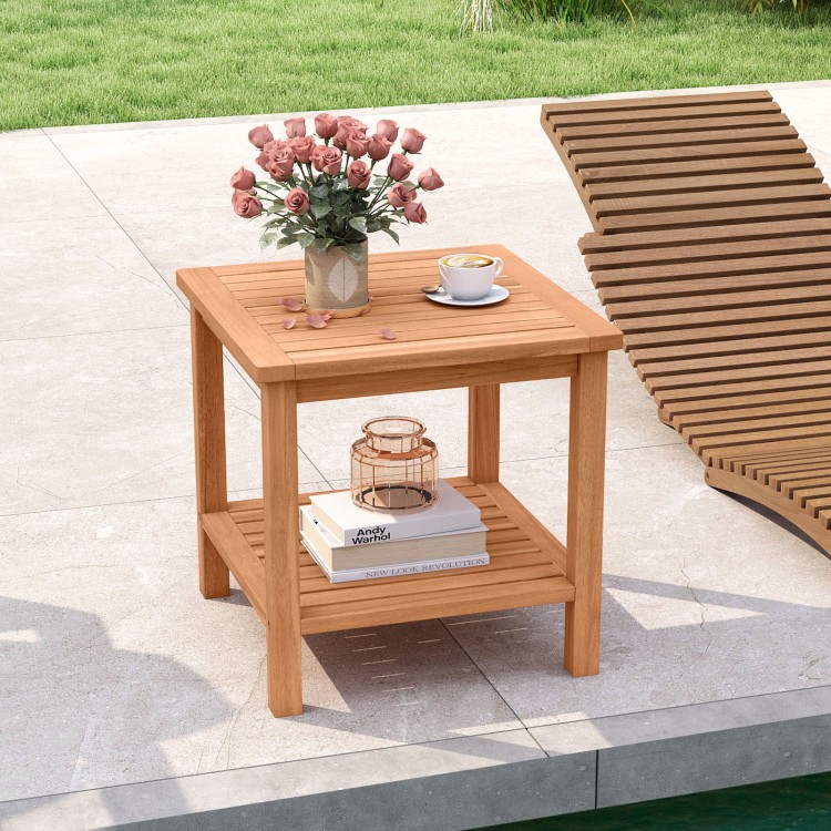 Acacia wood side table with slatted tabletop and storage shelf, ideal for patio or poolside use.