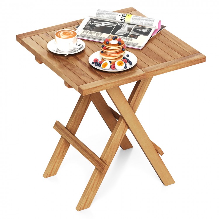 Patio folding side table made of teak wood with slatted tabletop, ideal for camping or backyard use.