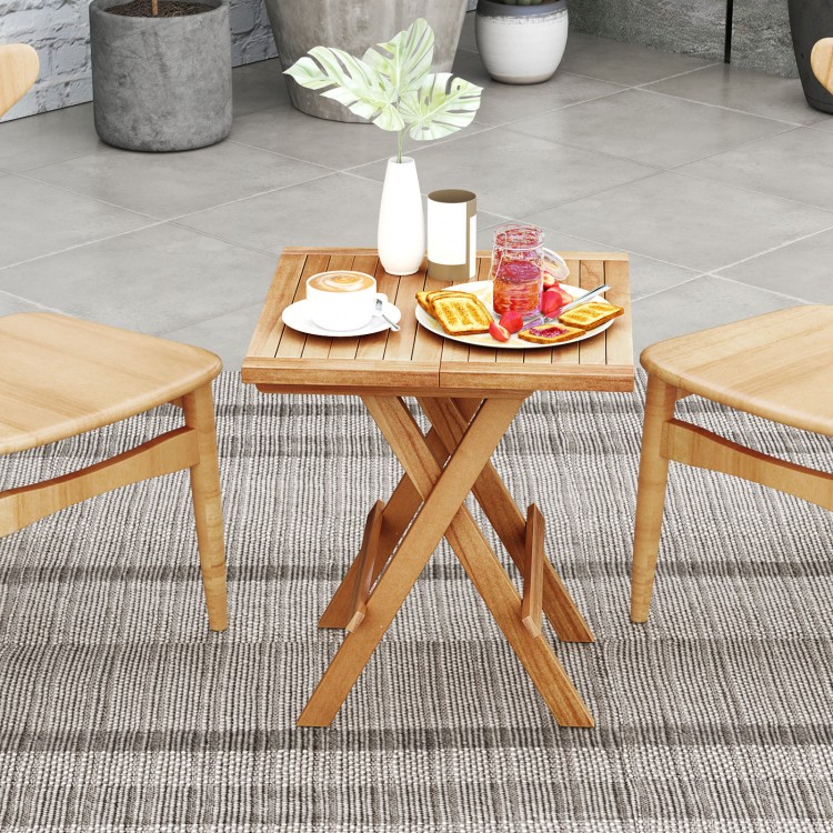 Patio folding side table with slatted teak wood top and X-shaped legs, perfect for outdoor dining and space-saving.