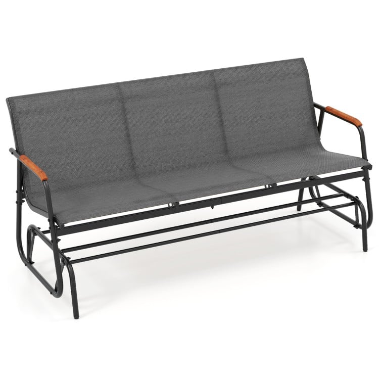 Patio glider bench for 3 people with grey breathable fabric seat and curved teak armrests, ideal for outdoor relaxation.