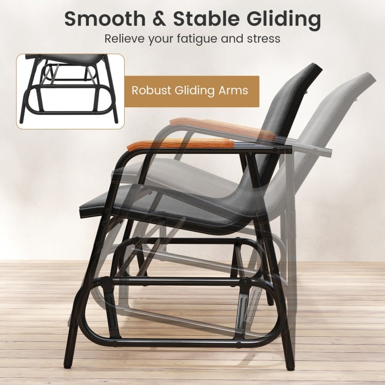 Patio glider bench with curved teak armrests and breathable fabric seat, showcasing smooth gliding motion for outdoor.