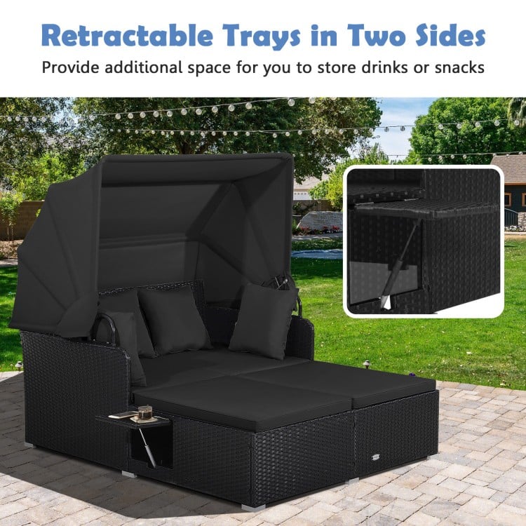 Patio rattan daybed with retractable canopy and foldable side trays, ideal for outdoor relaxation by the poolside.