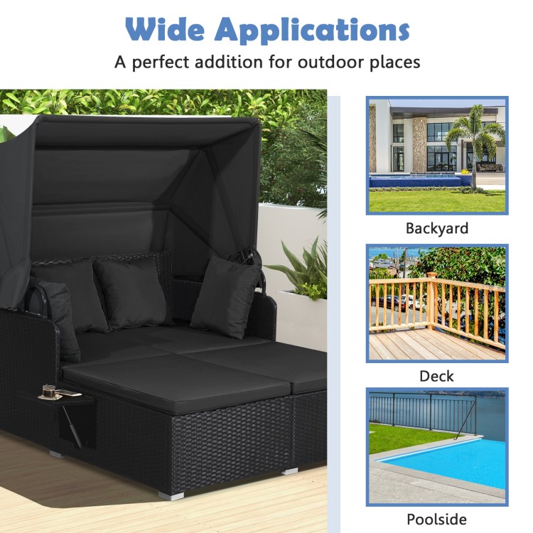Patio rattan daybed with retractable canopy and side tables, featuring soft cushions for backyard or poolside.