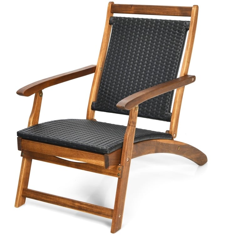 Patio rattan folding lounge chair with acacia wood frame, featuring a deep seat and ergonomic backrest for comfort.