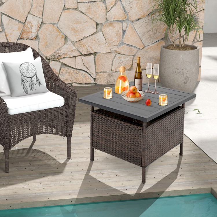 Square wicker side table with faux wood top and umbrella hole, perfect for poolside or garden use.