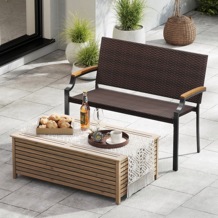 Patio wicker loveseat chair with acacia wood armrests and metal frame, perfect for outdoor relaxation in the garden.
