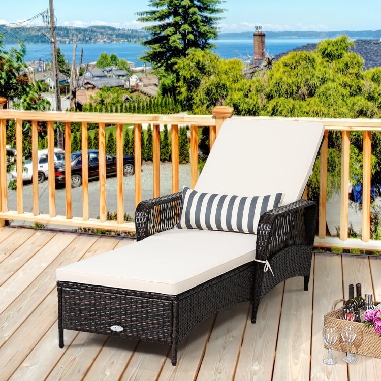 PE rattan chaise lounge chair with adjustable backrest and thick cushion, perfect for outdoor relaxation by the.