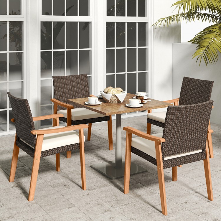 Four PE rattan outdoor patio dining chairs with acacia wood armrests and removable cushions, perfect for outdoor dining.