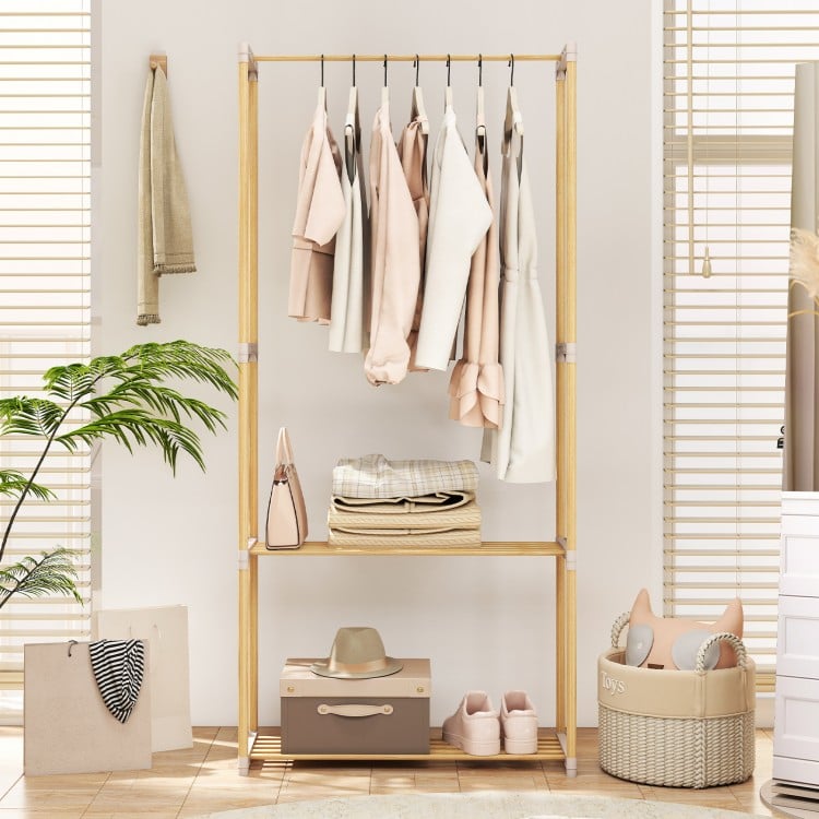 Pine wood clothes rack with 2-tier open storage shelf, perfect for organized hanging clothes in a stylish living space.