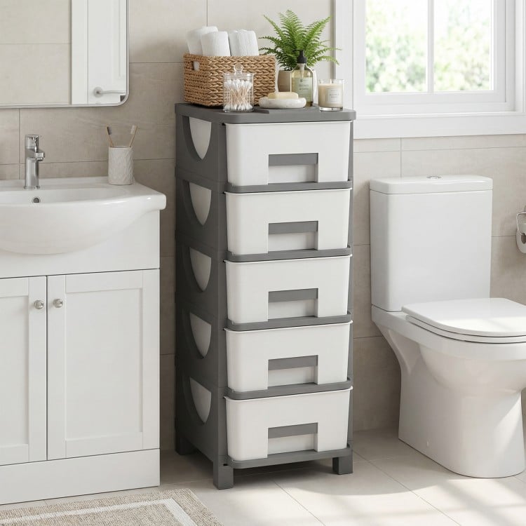 Gray plastic storage organizer with compact drawers, features easy-pull handles and a spacious tabletop for efficient.