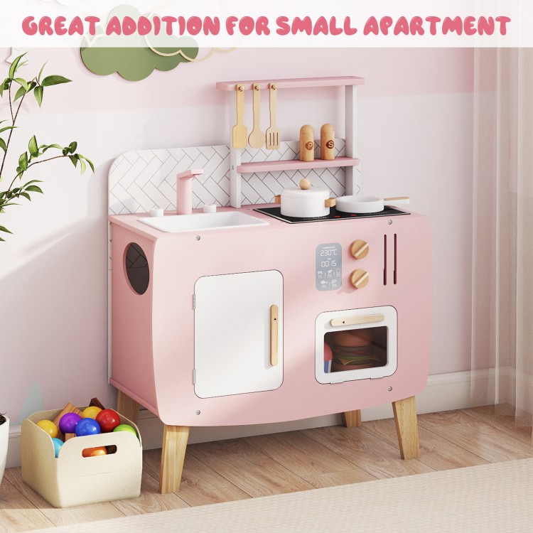 Wooden play kitchen set in pink with stoves, sink, and oven, perfect for small apartments and imaginative play.