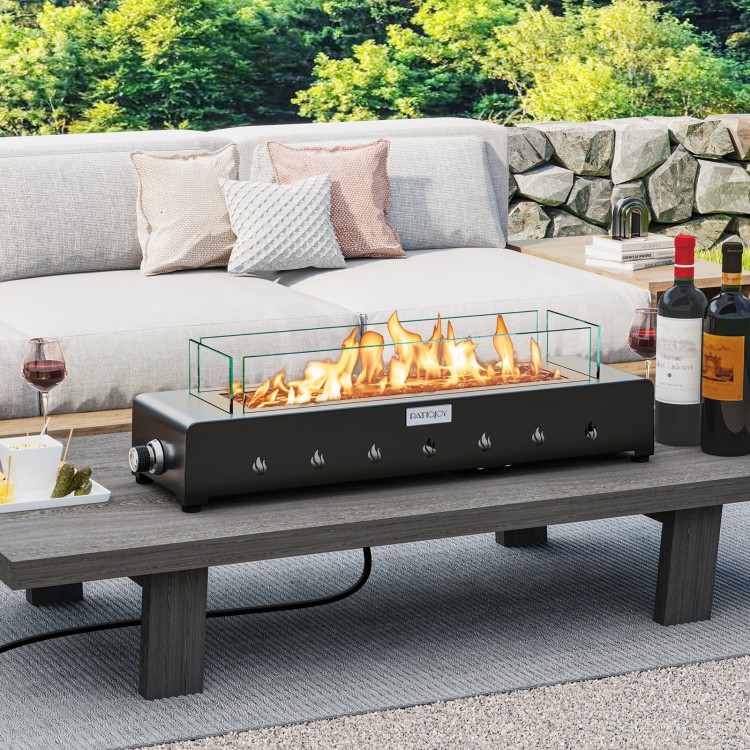 Portable mini fireplace with stainless steel burner and wind guard, perfect for outdoor table use and warmth.