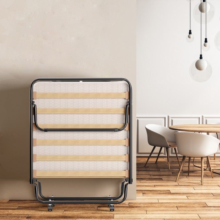 Portable folding bed with beige memory foam mattress and sturdy metal frame, ideal for limited spaces and easy mobility.