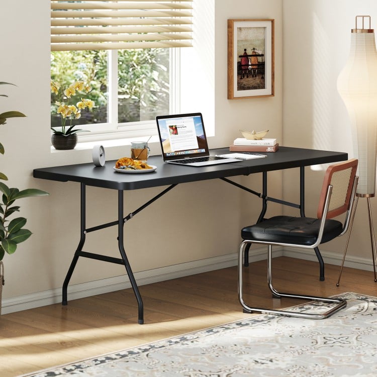 Portable folding camping table in black with large tabletop, sturdy steel frame, ideal for study or outdoor use.