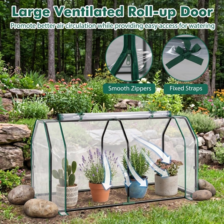 Portable mini greenhouse with a large roll-up zipper door, waterproof PE cover, and E-coated metal pipes for backyard use.