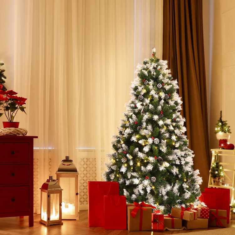 Pre-lit 6-foot snow flocked Christmas tree with red berries and 250 warm white LED lights, perfect for festive.