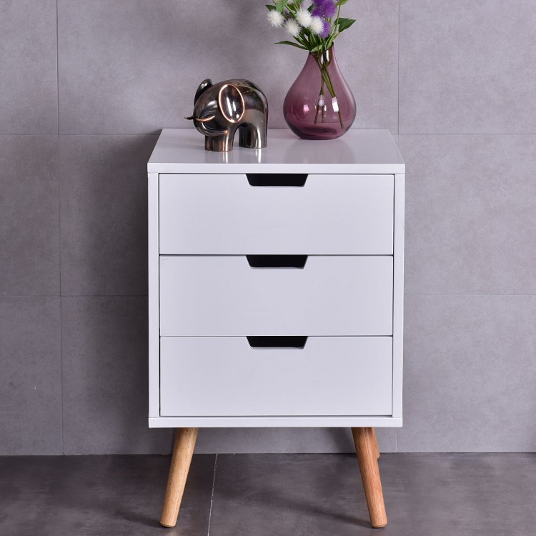 Front view of a stylish white wood nightstand with three drawers and oak legs, ideal for modern living room decor.