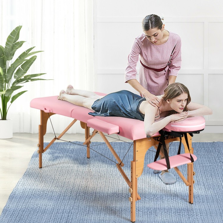 Foldable pink facial spa bed with adjustable height, used for massage and facial care, featuring a comfortable design.