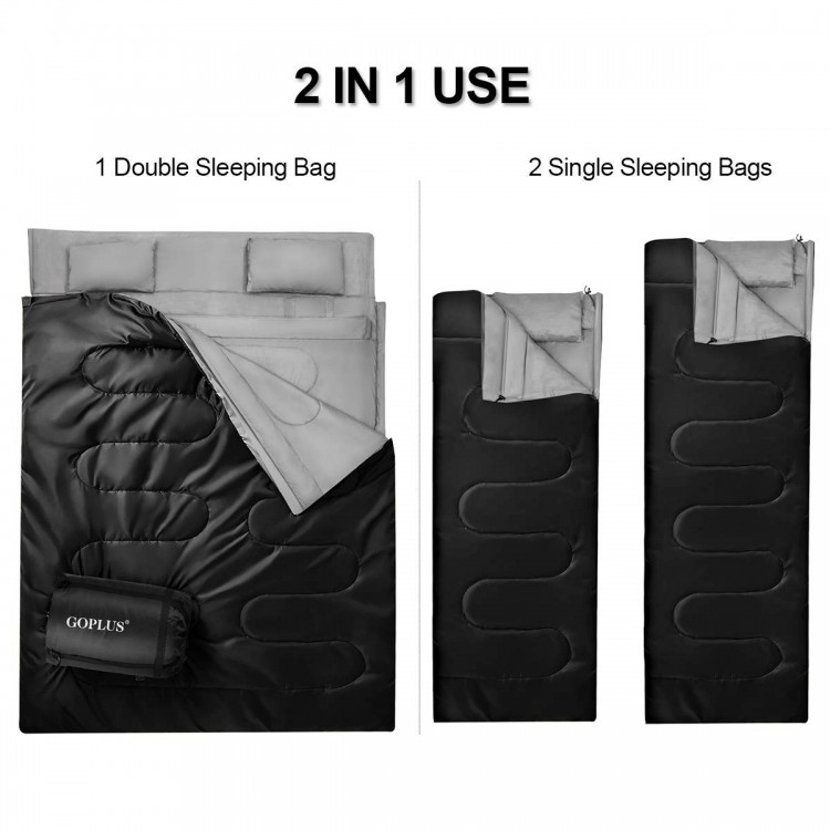 Double sleeping bag in black with two pillows, waterproof design, converts to two single bags for camping comfort.