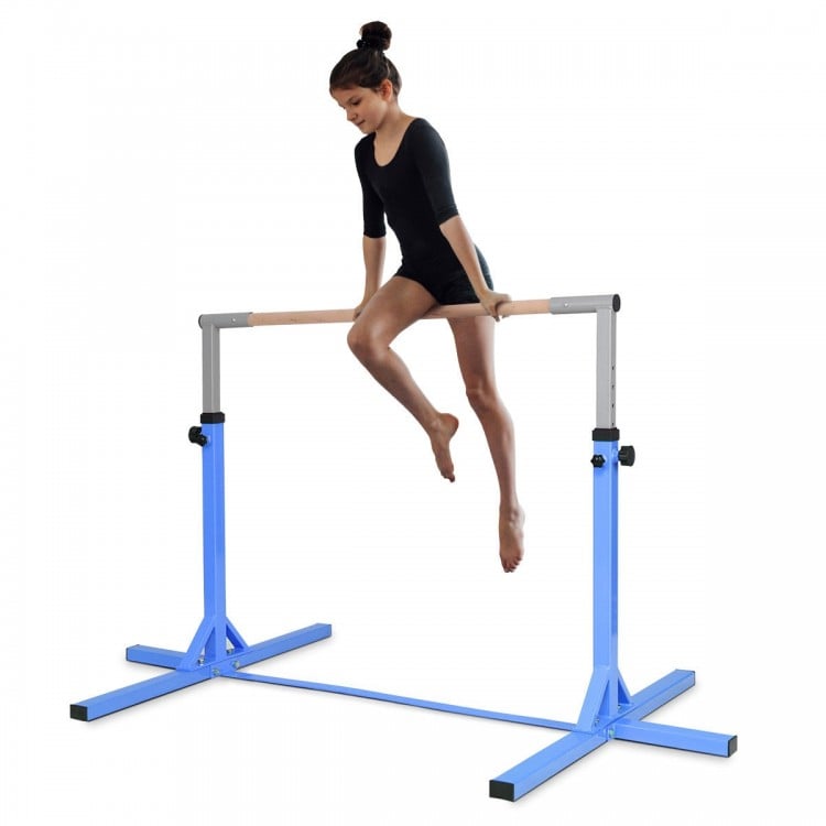 Child performing a skill on the adjustable blue gymnastics horizontal bar, with a height range of 36" to 59".