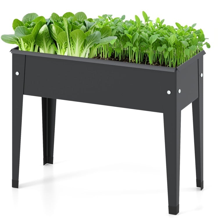 Elevated metal planter box with legs, featuring drainage holes, ideal for growing vegetables and herbs.