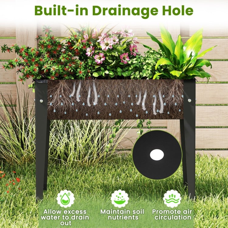 Elevated metal planter box with drainage hole, designed for healthy plant growth and easy access for gardening.